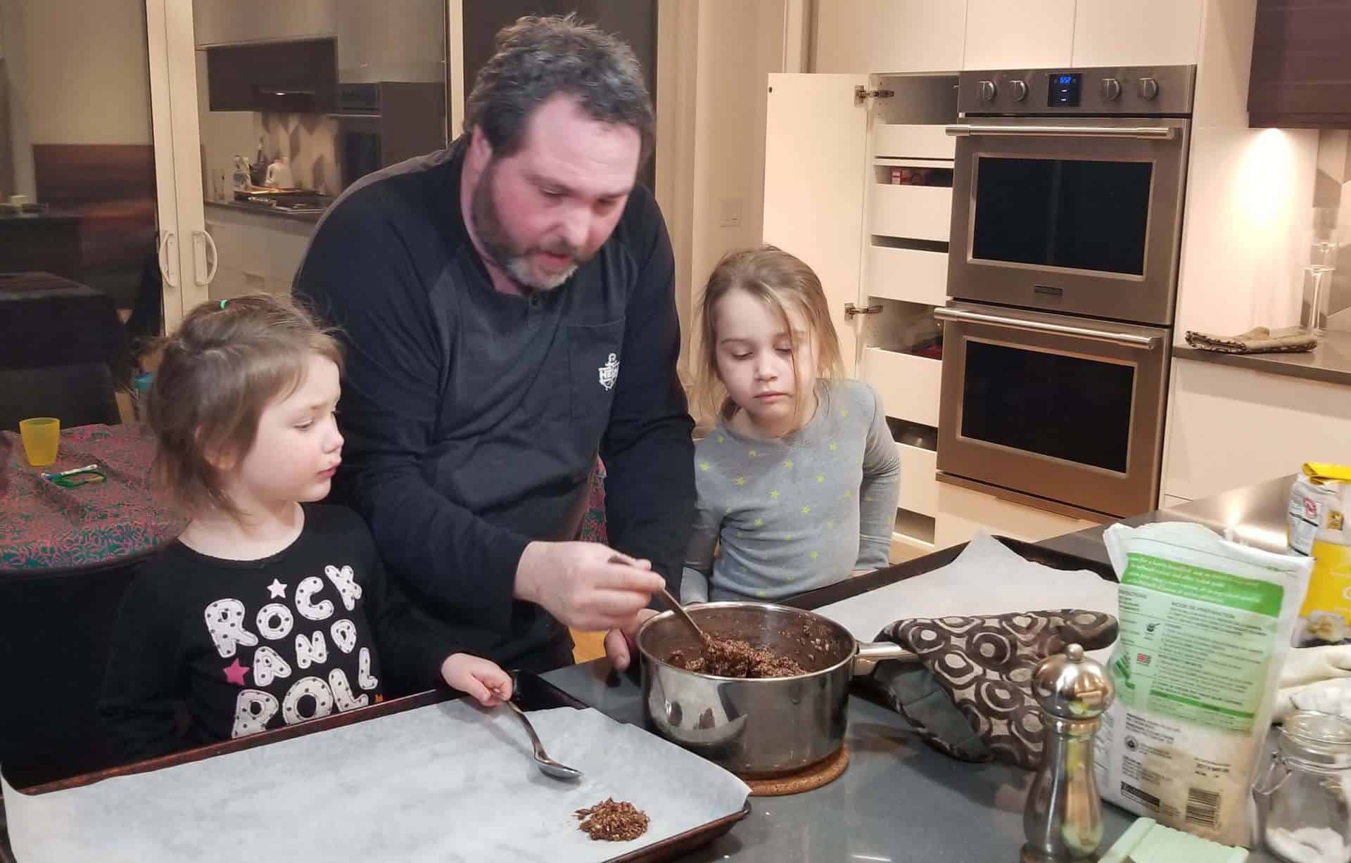 father-and-children-making-cookies
